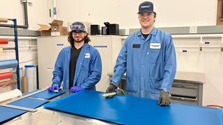 Peter and Matthew are cutting plies in preparation to layup sandwich panels to test in order to determine material properties for Peter's personal project this summer, making a prepreg skimboard.